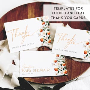 May include: Three white thank you cards with orange blossom and orange fruit illustrations. The cards are for a baby shower and say "Thank you" and "Sandra's Baby Shower".