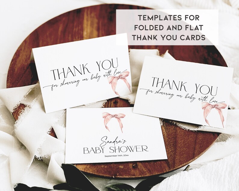 May include: Three printable thank you cards with pink watercolor bows. The cards say "Thank you for showering our baby with love". One card also includes the text "Sandra's Baby Shower September 10th, 20xx".