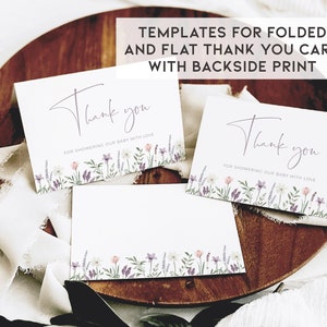 May include: Three white thank you cards with a floral border in shades of purple, pink, and green. The text on the cards reads "Thank you for showering our baby with love".