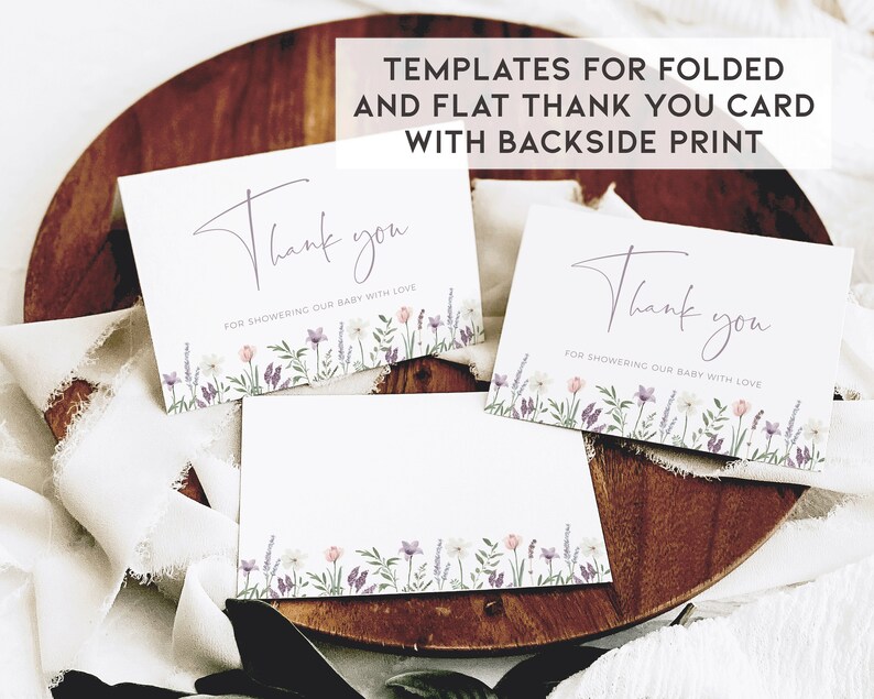 May include: Three white thank you cards with a floral border in shades of purple, pink, and green. The text on the cards reads "Thank you for showering our baby with love".