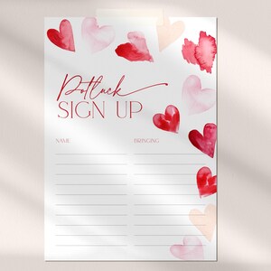 May include: A white sign with red text that says "Potluck Sign Up". There are two columns labeled "Name" and "Bringing". The sign is decorated with red and pink watercolor hearts.
