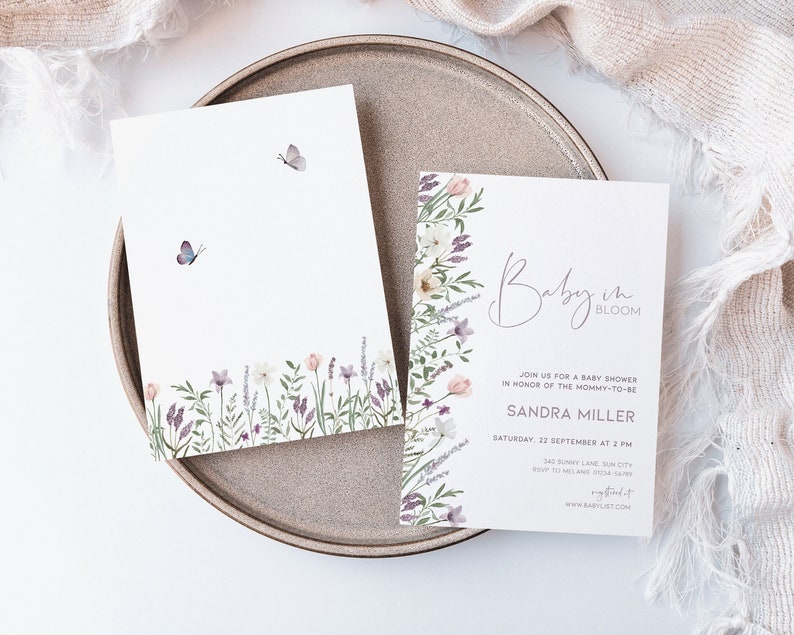 May include: A baby shower invitation with a floral design and the text "Baby in Bloom". The invitation includes the name "Sandra Miller" and the date and time of the shower.