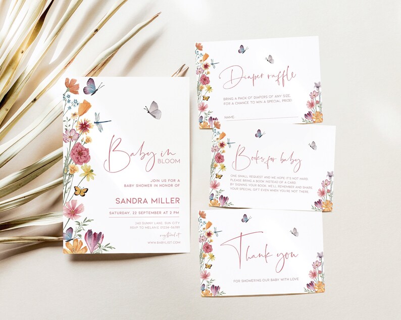 May include: A set of four baby shower cards with a floral design and butterflies. The cards are for a diaper raffle, books for baby, and a thank you card. The main card is a baby shower invitation with the text "Baby in Bloom" and the date and time of the shower.