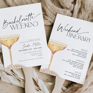 May include: A white invitation card with black text announcing a bachelorette weekend for Sandra Miller. The card features a watercolor illustration of a champagne flute with pearls. The back of the card has a white itinerary with black text listing the weekend's events.