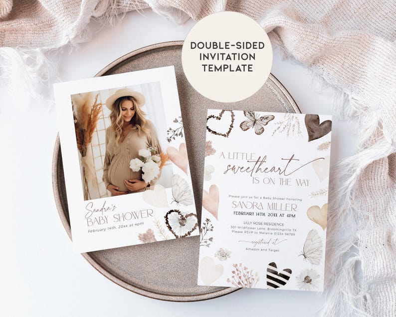 May include: A double-sided baby shower invitation template with a watercolor design featuring butterflies, hearts, and floral elements. The front side has a photo placeholder and the text "Sandra's Baby Shower". The back side has the text "A little sweetheart is on the way" and includes the details for the baby shower.