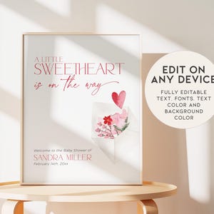 May include: A printable baby shower invitation with a pink and red watercolor design. The text reads "A little sweetheart is on the way." and "Welcome to the Baby Shower of Sandra Miller, February 14th, 20xx".