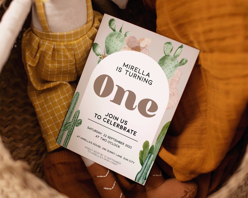May include: A cactus-themed first birthday party invitation with a watercolor design. The invitation reads "Mirella is turning one. Join us to celebrate. Saturday, 22 September 2023 at two o'clock. At Mirella's house, 340 Sunny Lane, Sun City. Kindly RSVP by 12 September to Mirella's mom Cindy."