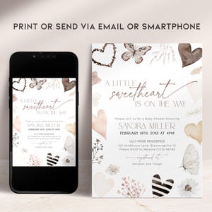 May include: A white baby shower invitation with a watercolor design featuring butterflies, hearts, and floral elements. The text reads "A little sweetheart is on the way" and includes the name "Sandra Miller" and the date "February 14th, 2021 at 4pm".