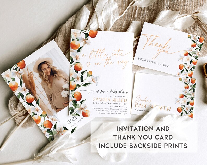 May include: A set of two baby shower cards with a floral design featuring orange blossoms and fruit. The invitation card says "A little cutie is on the way" and the thank you card says "Thank you" with the text "Sandra's Baby Shower".