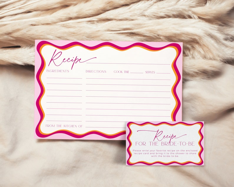 May include: Pink and orange recipe cards with a wavy border. The top card has a blank recipe template with headings for ingredients, directions, cook time, and serves. The bottom card has the text "Recipe for the Bride-to-Be" and instructions to write a favorite recipe on the enclosed card and bring it to the shower to share with the bride-to-be.