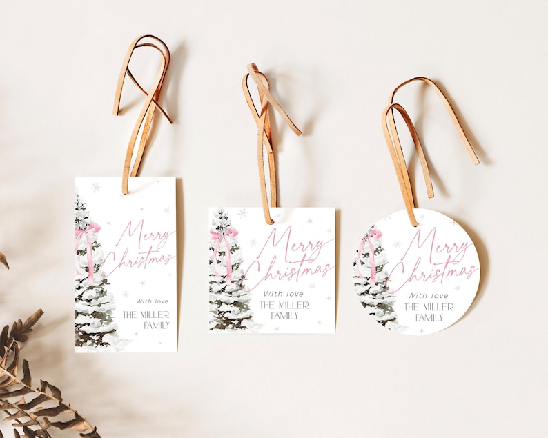 May include: Three Christmas gift tags with a watercolor illustration of a snowy pine tree with a pink ribbon. The tags are white with pink text that reads "Merry Christmas" and "With love, The Miller Family".