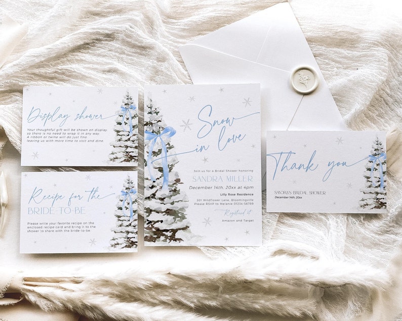 May include: A set of four winter-themed bridal shower invitations with a watercolor illustration of a snowy pine tree with blue ribbon. The text on the invitations reads "Display Shower", "Recipe for the Bride to Be", "Snow in Love", and "Thank You".