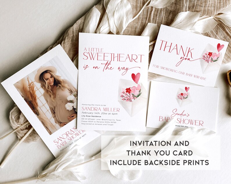 May include: A pink and white watercolor floral design with a heart on a white baby shower invitation card. The text on the card reads "A little sweetheart is on the way" and "Sandra Miller, February 14th, 20xx at 4pm". A matching thank you card reads "Thank you for showering our baby with love" and "Sandra's Baby Shower".