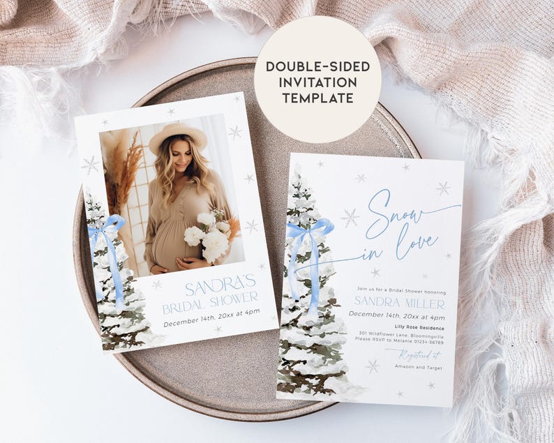 May include: A double-sided invitation template for a bridal shower with a winter theme. The front features a watercolor illustration of a snowy pine tree with a blue ribbon. The back features a photo of the bride-to-be and the text "Sandra's Bridal Shower" and "December 14th, 20xx at 4pm". The text "Snow in Love" is written in a cursive font.