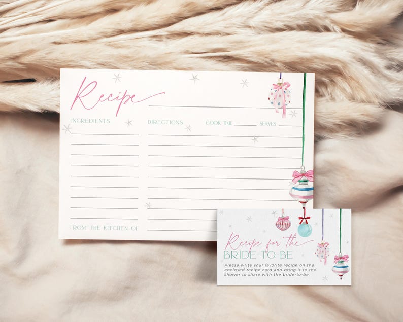 May include: A printable recipe card with a winter theme. The card features a pink and blue watercolor illustration of ornaments and snowflakes. The text on the card reads "Recipe for the Bride-to-Be".