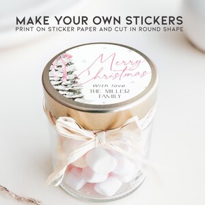 May include: A glass jar filled with white marshmallows, tied with a beige ribbon, and topped with a round sticker that reads "Merry Christmas" in pink script with the text "With love THE MILLER FAMILY" below.