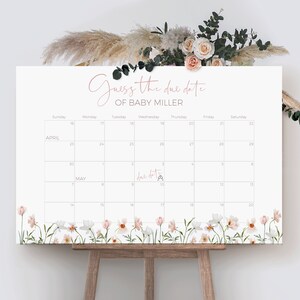 May include: A white calendar with a floral border. The calendar is for April and May and has the text "Guess the due date of Baby Miller" at the top. The due date is marked on the calendar as May 9th.
