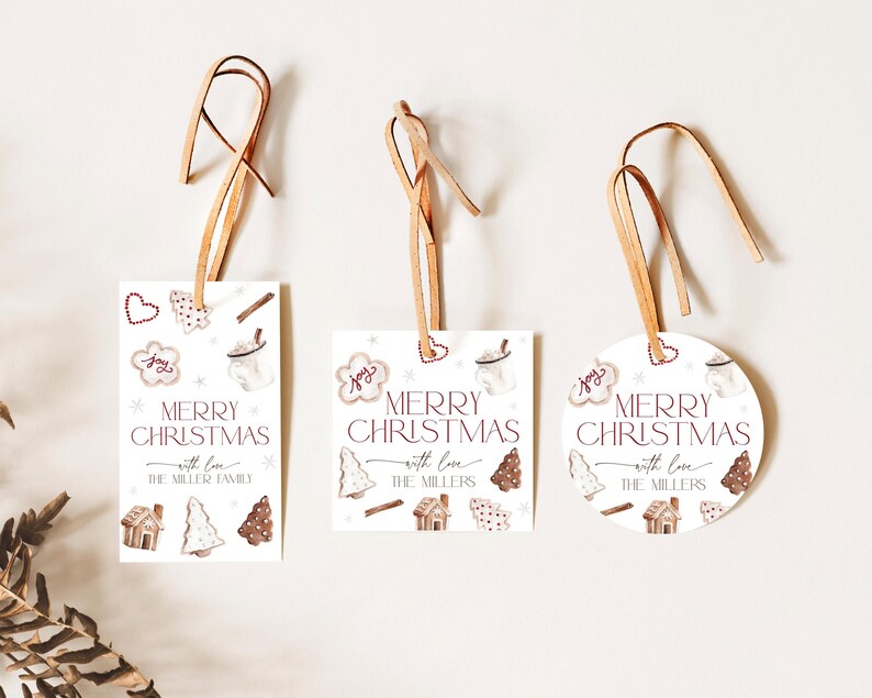 May include: Three Christmas gift tags with brown twine. The tags feature a watercolor illustration of gingerbread cookies, a mug of hot chocolate, and the text "Merry Christmas with love The Millers".