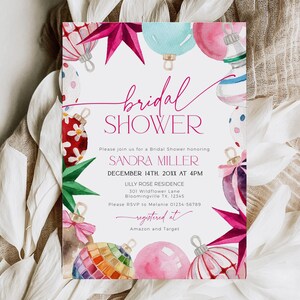 Puede incluir: Una invitaci&oacute;n de ducha nupcial blanca con adornos de acuarela rosa y rojo. El texto dice "bridal shower" en escritura cursiva rosa y "Please join us for a bridal shower honoring Sandra Miller December 14th, 20XX at 4PM Lilly Rose Residence 301 Wildflower Lane Bloomingville TX 12545 Please RSVP to Melanie 01234-56789 registered at Amazon and Target".