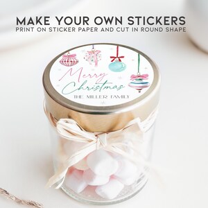 May include: A round sticker with a white background and colorful Christmas ornaments. The text "Merry Christmas" is written in pink and blue script. The text "The Miller Family" is written in black below the ornaments.