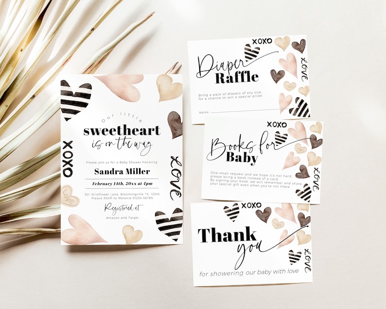 May include: A set of four baby shower cards featuring a watercolour heart design. The cards include a diaper raffle, books for baby, a thank you card, and a baby shower invitation. The invitation reads "Our little sweetheart is on the way" and includes the date and time of the shower. The cards are decorated with hearts in shades of pink, brown, and gold.