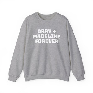 May include: A gray sweatshirt with the text "Orry + Madeline Forever" printed in white on the front.