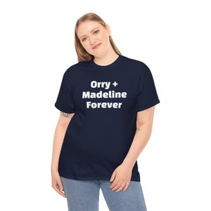 May include: A navy blue t-shirt with white text that reads "Orry + Madeline Forever".