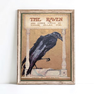 The image is a framed print of a book cover for "The Raven" by Edgar Allan Poe.