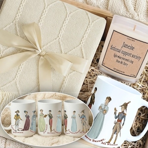May include: A gift set featuring a cream-colored blanket tied with a ribbon, a candle with text, and several white mugs with illustrations of characters. The candle reads "Janeite fictional support society". The mugs have illustrations of characters.