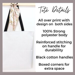 a white tote bag hanging on a wall