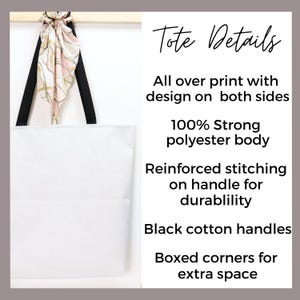 a white tote bag hanging on a wall