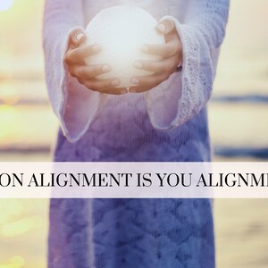 May include: A person holding a white orb in their hands, with the text "MOON ALIGNMENT IS YOU ALIGNMENT" across the bottom of the image.