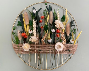 Spring wall hanging for sunny home. Easter Blooming decoration with dried flowers for present.