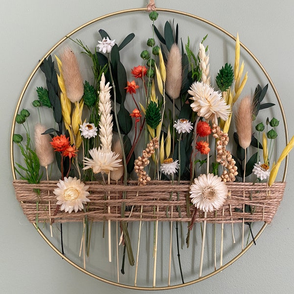 Spring wall hanging for sunny home. Easter Blooming decoration with dried flowers for present.