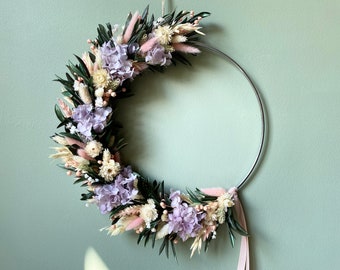 A romantic spring wreath adorned with olive leaves, hydrangea, and pink grasses. One of kind home decoration