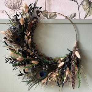 Unique boho wreath made of eucalyptus leaves with natural peacock feathers / Dried flowers, shades of dark green. Gold hoop. One and only