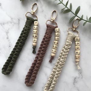 There is a personal name next to the macrame key chains, which are knitted with 100% natural cotton yarn.