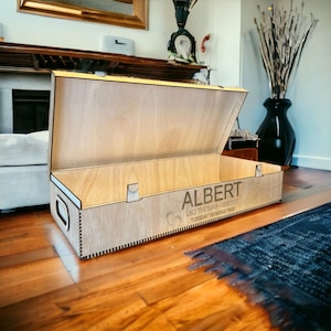 May include: A wooden keepsake box with a hinged lid, personalised with the name "ALBERT", the text "LEO THOMAS - EXETER", and the date "TUESDAY 13/09/2022 16:22".