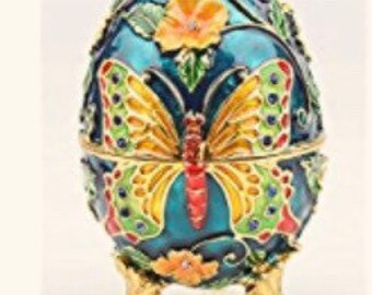 Faberge garden replica egg. This is great for butterflies and flower lovers. Swarovski crystals only 2 left  4.2” new spring egg.