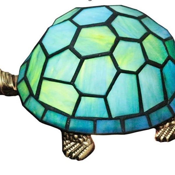 This is a beautiful stained glass turtle lamp. The colors on his back are greens and blues. Great for kids,butterfly on head. 8x5x4”