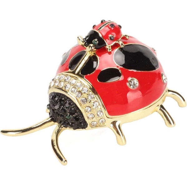 Ladybug trinket bar with a baby ladybug on top of it. This is 2.7 inches long and can hold pills or small jewelry.