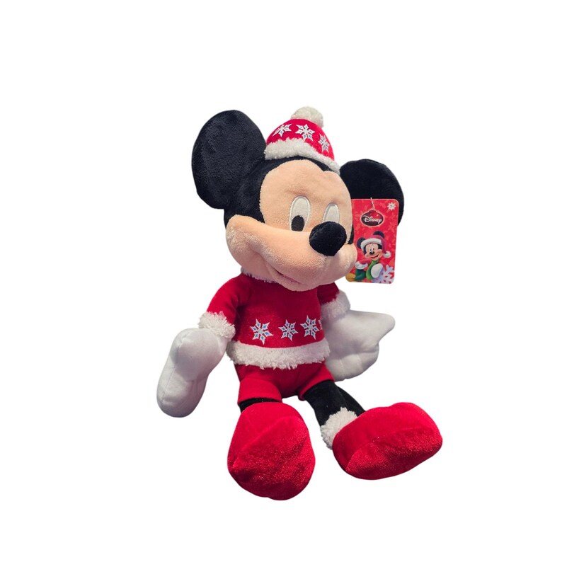 Op de afbeelding: Een pluche Mickey Mouse-speelgoed gekleed in een rood kerstoutfit met witte sneeuwvlokaccenten. Het speelgoed heeft een bijpassende hoed en een Disney-label. De zwarte oren en het gezicht contrasteren met de rode en witte kleding.