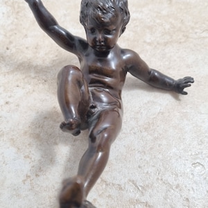 Antique bronze statue of boy standing on tortoise by Otto Geyer c 1880