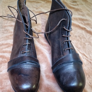 Pair leather vintage style football boots