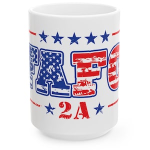 May include: White ceramic mug with the text "PATFO 2A" in red and blue, with a design reminiscent of the American flag. The mug features stars and stripes, and is a patriotic themed item.