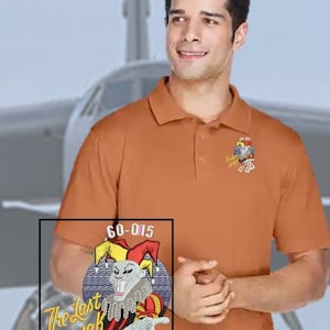 B-52 nose art Polo: Perfect Blend of Comfort, Durability, and Style. Left chest of this polo is elegantly embroidered with B-52 nose art.
