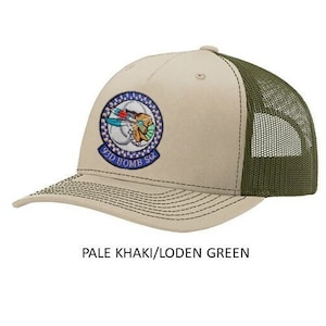 May include: A pale khaki and loden green trucker hat with a blue, white, and red embroidered patch that says "99th Bomb Sq".