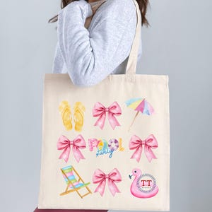 May include: A white tote bag with a pink flamingo, a beach chair, a beach umbrella, flip flops, and pink bows. The text "Pool Party" is printed on the bag.
