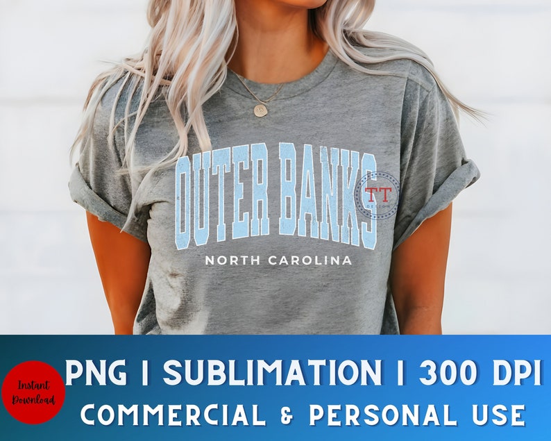 May include: A gray t-shirt with a blue and white graphic that says "Outer Banks" and "North Carolina".