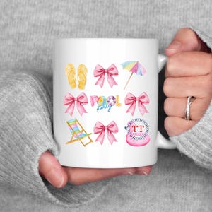 May include: White ceramic mug with a pink, blue, and yellow watercolor design. The design includes flip flops, a beach chair, a pool float, an umbrella, and the words "Pool Party".